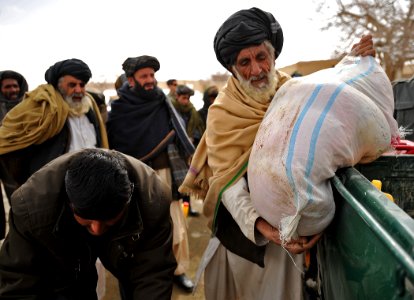 Afghan National Police-coalition specal operations forces food handout 120205-N-UD522-094