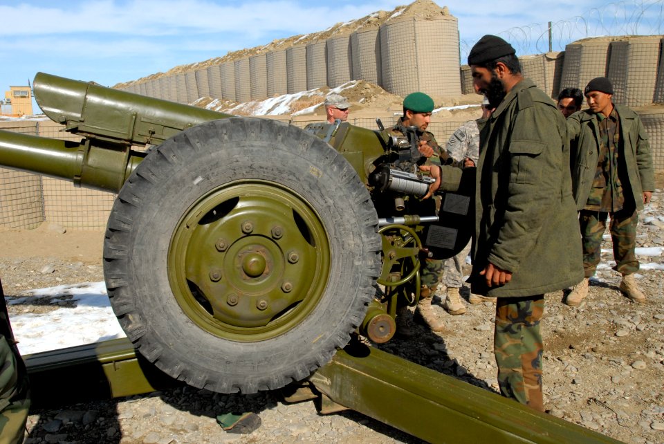 Afghan soldeirs prepare to fire a D-30 122 mm howitzer