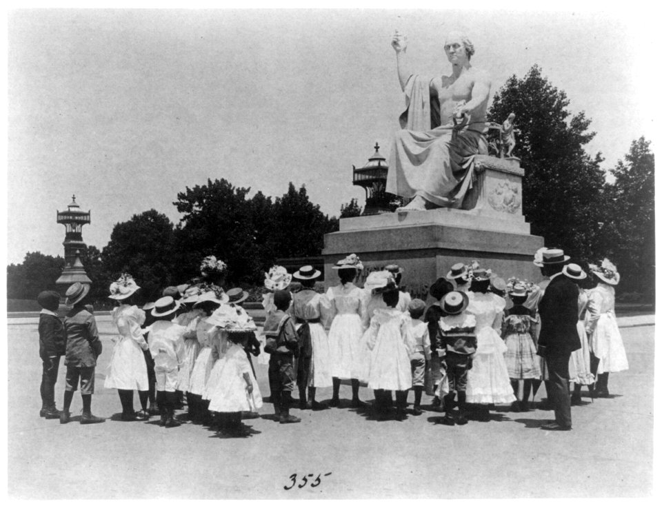 African American school children facing the Horatio Greenough statue of George Washington at the U.S. Capitol LCCN2001696797