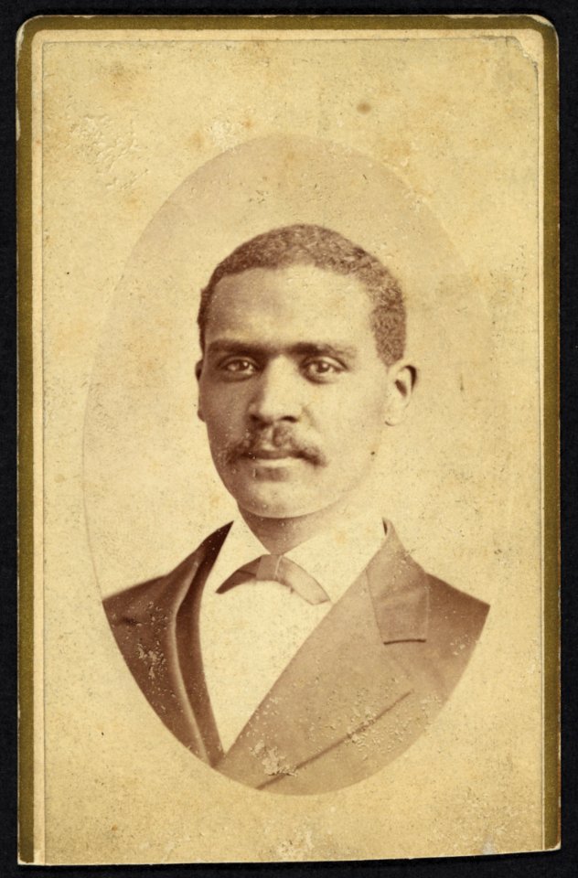 African American man in suit, head-and-shoulders-portrait, facing front) - M. Wolfe, Photographer. No. 106 South Main Street, Dayton, Ohio LCCN2010647830
