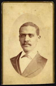 African American man in suit, head-and-shoulders-portrait, facing front) - M. Wolfe, Photographer. No. 106 South Main Street, Dayton, Ohio LCCN2010647830