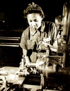 African American worker undersizing bushings at Naval Aircraft Factory, Philadelphia, PA, WWII (26386665714)