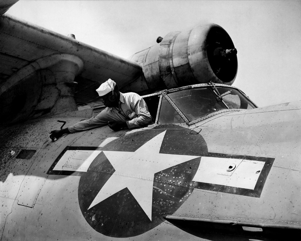 African-American mechanics work on PBY at NAS Seattle, WA, Alvin V. Morrison, AMM 3-c, doing overhaul, 04-27-1944 - NARA - 520648 restored