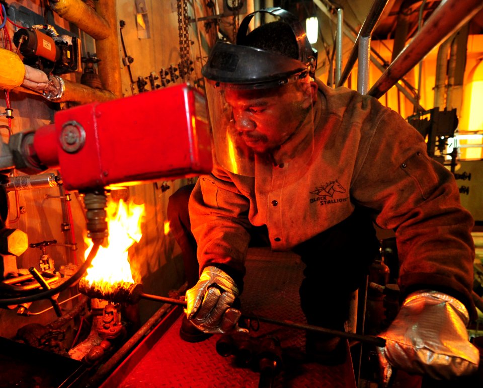African-American civil service mariner detail, from- US Navy 110504-F-ET173-055 Engine Utility Willie Grant lights off a burner aboard the Military Sealift Command hospital ship USNS Comfort (T-AH 20) (cropped)