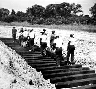 African-American workers laying railroad ties for spur line, 1942 (27255092036) photo