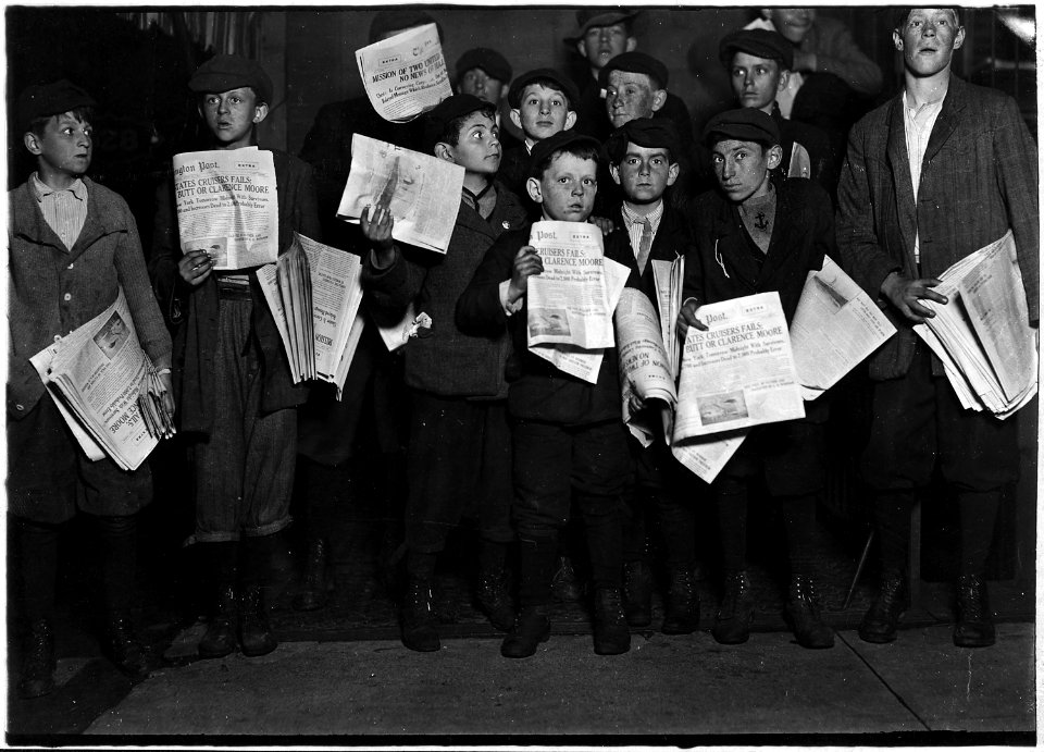 After midnight selling extras. There were many young boys selling very late these nights. Youngest boy in the group... - NARA - 523536