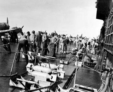 Aircraft are armed on USS Enterprise (CV-6) in early 1942 photo