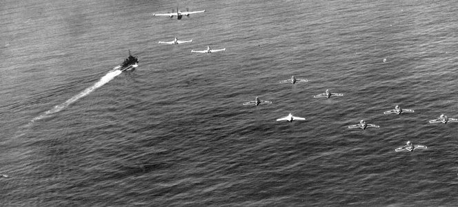 Aircraft of U.S. Navy Air Task Group 3 in flight over a destroyer, in 1956