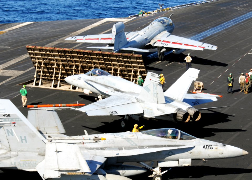 Aircraft move around the flight deck of USS Nimitz. (8227414744)