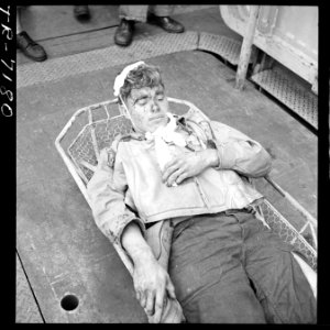 Aircrewman, wounded during raid on Rabaul, on board the USS Saratoga (CV-3). Alva Parker (ARM1) who suffered shrapnel... - NARA - 520891