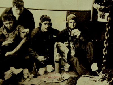 Airmen relax and enjoy their lunch after bombing Wake Island, 1942 (21728585809)