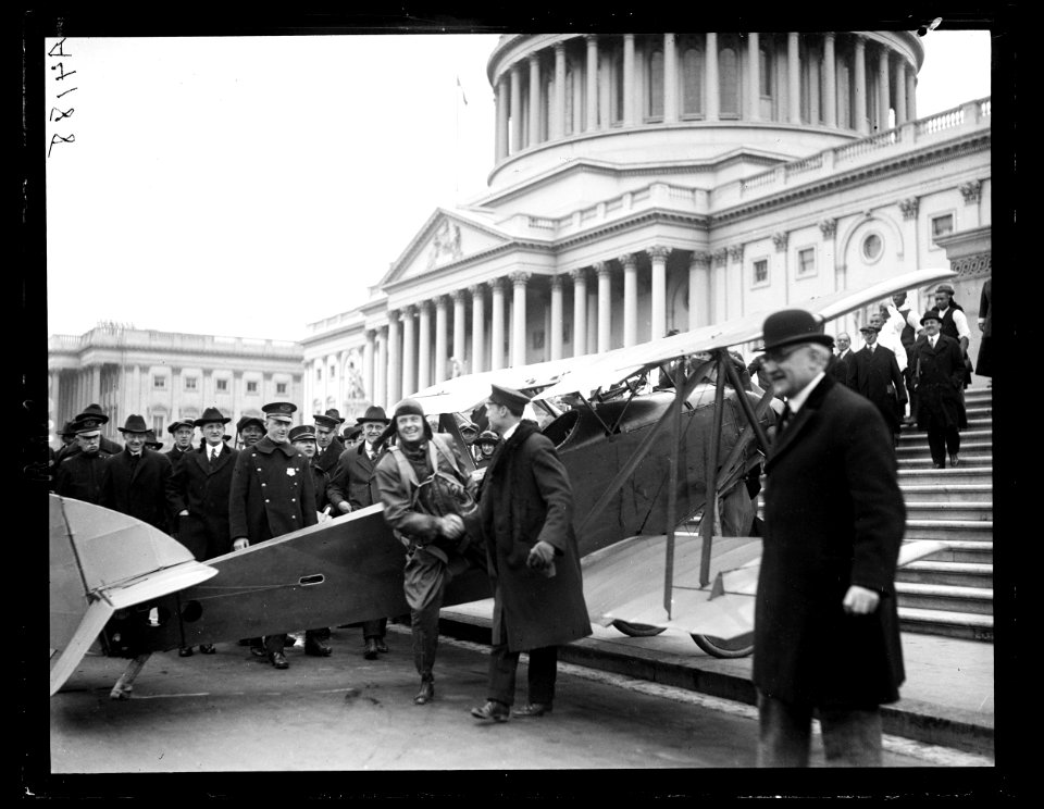 Airplane in front of U.S. Capitol, Washington, D.C. LCCN2016891293