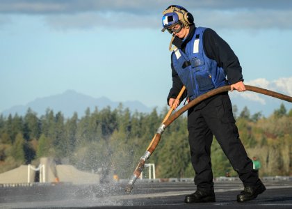 Airman cleans out padeyes 161103-N-DA275-073