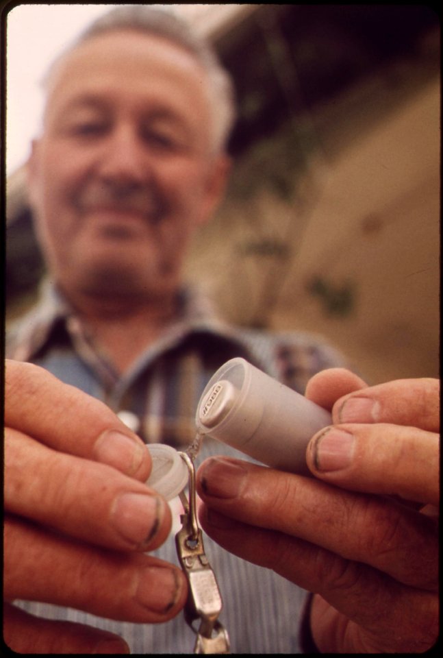 Alamo-wearer-of-tld-thermo-huminescent-docimeter-gets-a-fresh-capsule-these-tld-capsules-measure-radioactive-fallout-and-are-exchanged-monthly-may-1972 7006551526 o