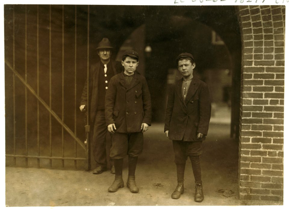 Alber Therien at right end of picture, 30 Salem Street, appears 13 years old, has been 4 weeks in spinning room No. 9, on the fourth floor of the Lawrence mills. Joseph Guerard, left hand LOC cph.3b25351
