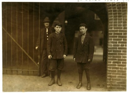Alber Therien at right end of picture, 30 Salem Street, appears 13 years old, has been 4 weeks in spinning room No. 9, on the fourth floor of the Lawrence mills. Joseph Guerard, left hand LOC cph.3b25351