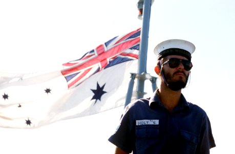 Australian sailor beneath White Ensign photo