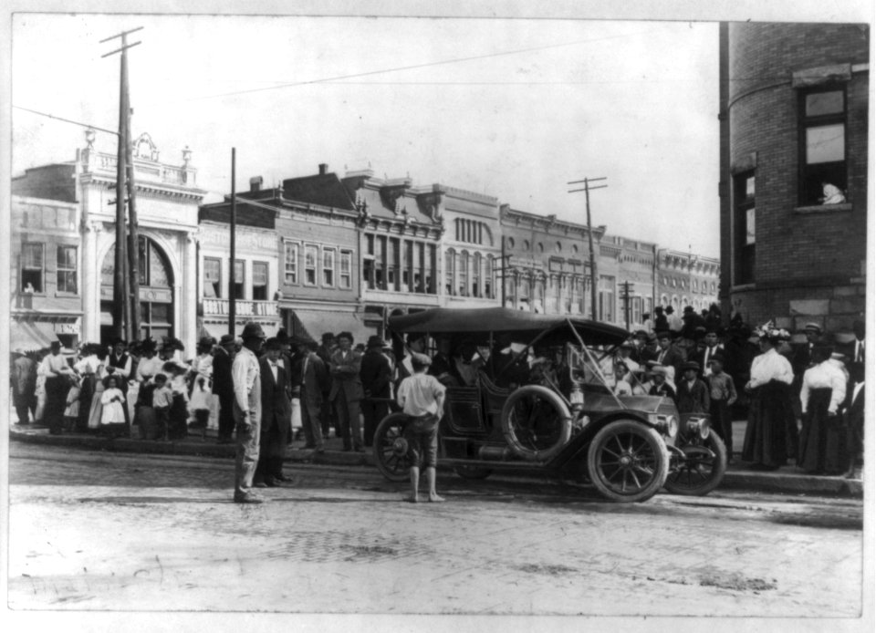 Automobile parked on street, with crowd lined along pavement) Court Square, Anderson, S.C LCCN2011661040