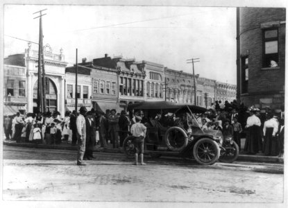 Automobile parked on street, with crowd lined along pavement) Court Square, Anderson, S.C LCCN2011661040