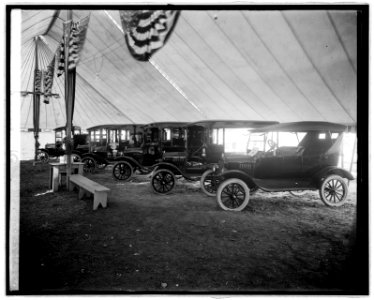 Automobiles on display in tent LCCN2016824037