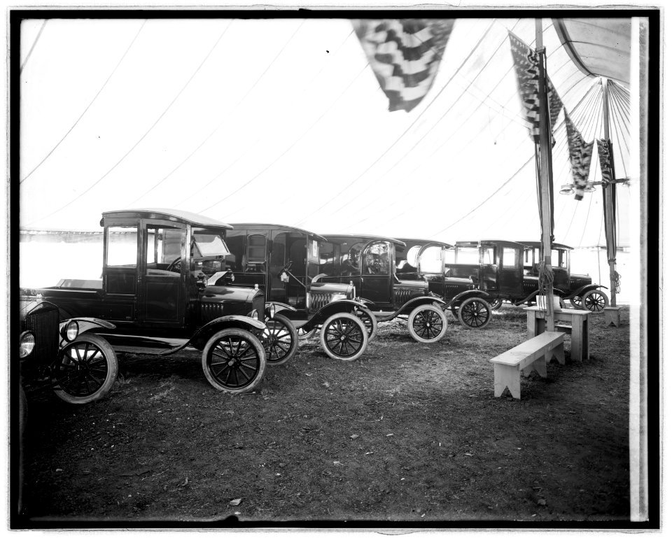 Automobiles on display in tent LCCN2016824035
