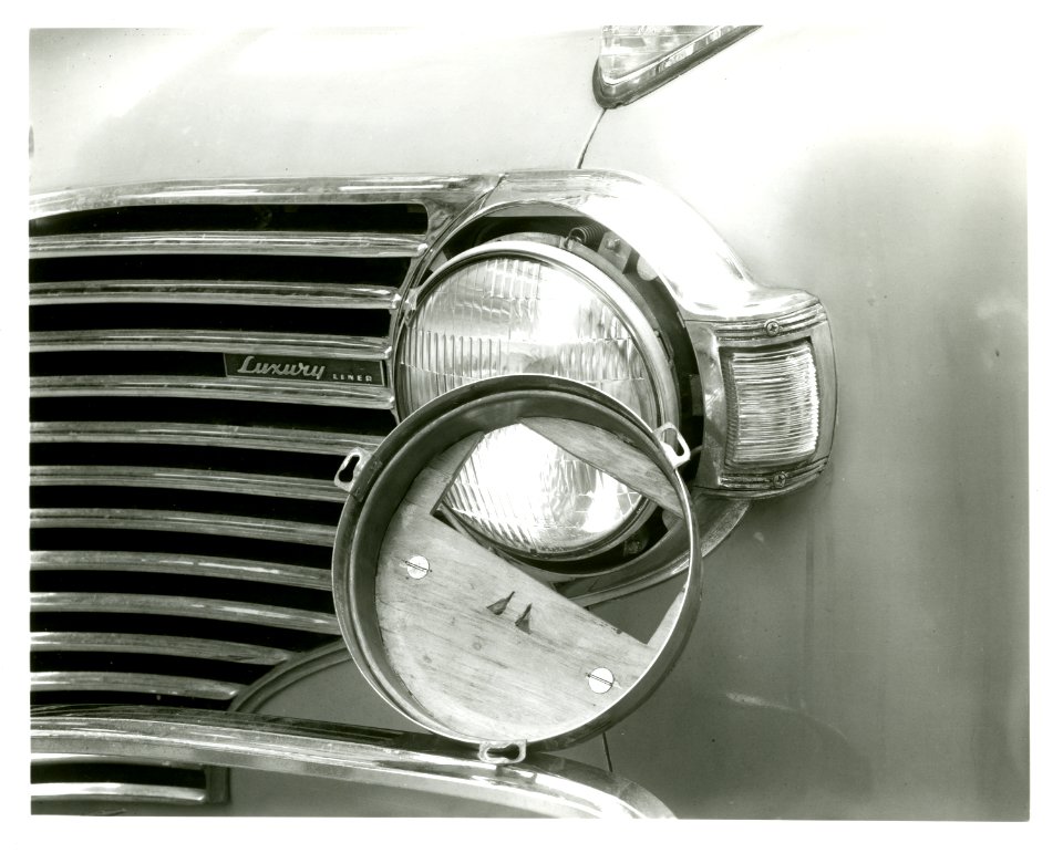 Automotive headlighting device for dimout and blackout