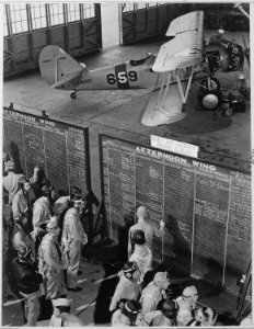 Aviation cadets check flight boards for last minute instructions at Naval Air Training Center Corpus Christi, Texas.... - NARA - 520975