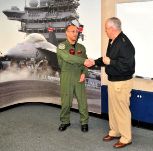 AWS1 Anthony Michalski with Vice Admiral David Architzel photo