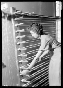 Beula Ogle preparing warp for weaving at the Pi Beta Phi School, Gatlinburg, Tennessee. She is a new weaver at the... - NARA - 532765 photo