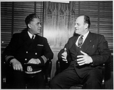 Capt. Clifton Lastic, Master of Liberty Ship (SS) Bert Williams chats with Joe Curran, President of N.M.U. (National Ma - NARA - 542397