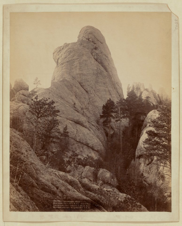 Calamnity (i.e. Calamity) Peak. Near Custer City on B. & M. R'y. Title of Peak from the most noted character in Black Hills LCCN99613940