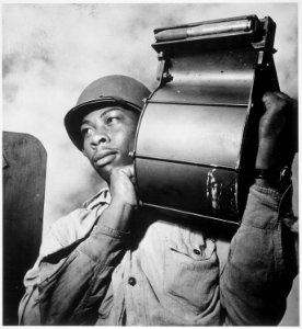 Crewmen aboard U.S.S. Tulagi (CVE-72) en route to southern France for Aug. 15th invasion. Miles Davis King, StM 2-c, ca - NARA - 520763
