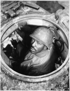 Cpl. Carlton Chapman...is a machine-gunner in an M-4 tank, attached to a Motor Transport unit near Nancy, France., 11- - NARA - 531221 photo