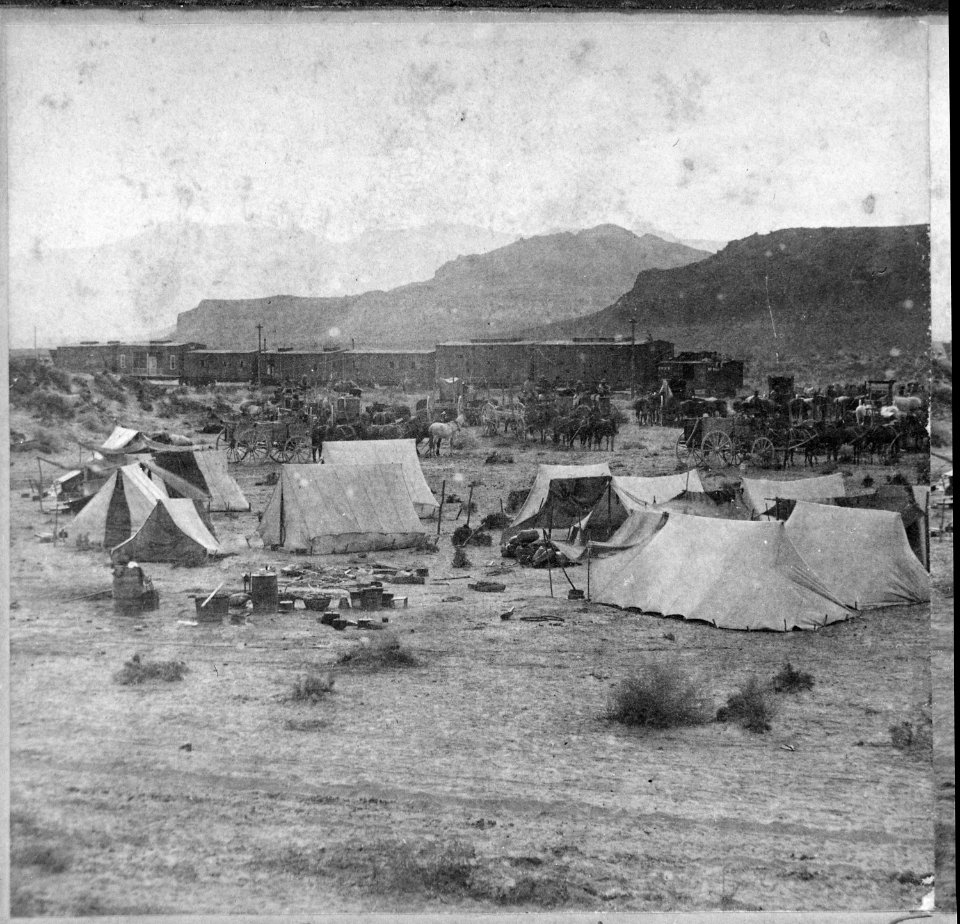 End of the Track. Near Humboldt River Canyon, Nevada. Campsite and train of the Central Pacific Railroad at foot of mo - NARA - 533792