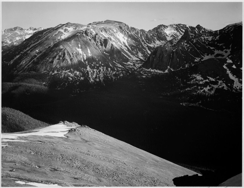 In Rocky Mountain National Park, Colorado, panorama of barren mountains and shadowed valley., 1933 - 1942 - NARA - 519964