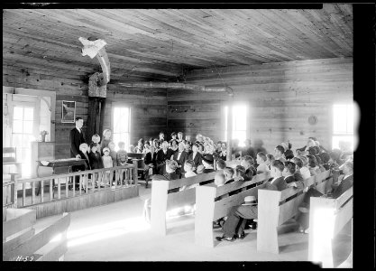Interior view of Sharps Station M.E. Church near Loyston, Tennessee. Reverend Lovelace and some children from an... - NARA - 532682
