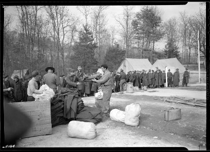 Issuing cots and blankets to new replacements just arrived from New York at CCC Camp, TVA ^23, located just north of... - NARA - 532782