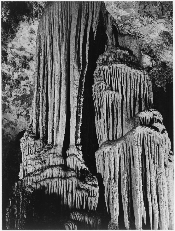 Large stalagmite and stalactite formations in the King's Chamber, detail, Carlsbad Caverns National Park, New Mexico. - NARA - 520044