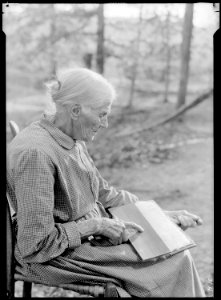 Mrs. Sarah J. Wilson, Bulls Gap, Tennessee. In addition to daily work around the home, she finds time to raise some... - NARA - 532636 photo