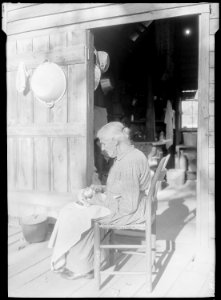 Mrs. Sarah J. Wilson, Bulls Gap, Tennessee. The chair on which she is sitting is an example of the furniture made in... - NARA - 532634