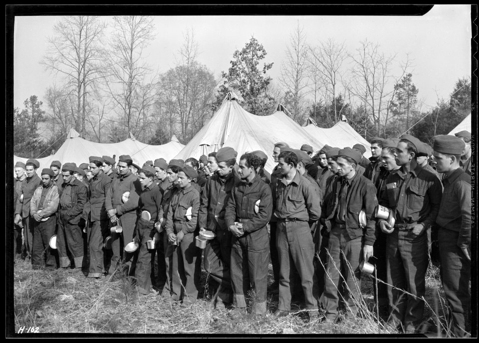 Newly-arrived replacements at CCC Camp, TVA ^22, near Esco, Tennessee, lined up before their first meal in camp. The... - NARA - 532780
