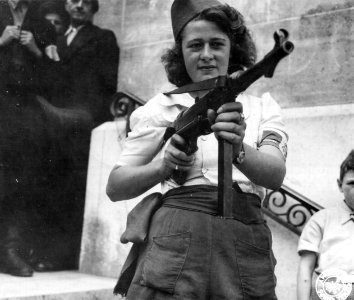 Nicole a French Partisan Who Captured 25 Nazis in the Chartres Area, in Addition to Liquidating Others, Poses with... - NARA - 5957431 - cropped photo