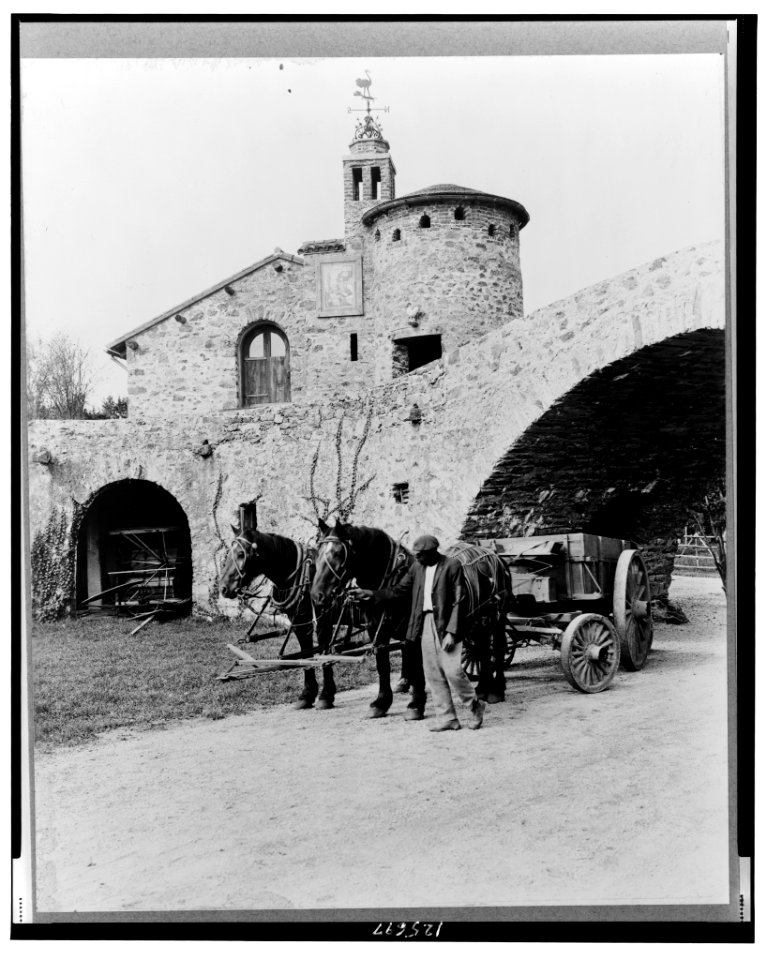 Surprise Valley Farm, Arthur Curtiss James property, Beacon Hill Road, Newport, Rhode Island. Courtyard with wagon and team and African American workman LCCN00651310