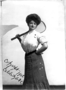 Tennis Girl - woman posed with tennis racket on shoulder, three-quarters length, standing, facing front LCCN2006679980