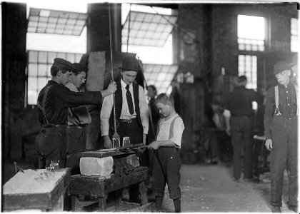 Teaching the young idea. The boss (who began at 10 years of age, and has been at it for 30 years) showing a... - NARA - 523093