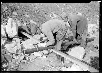 William L. Carden, of Anderson County, Tennessee, acetylene burner, cutting pipe at Norris Dam site. The helper is... - NARA - 532683