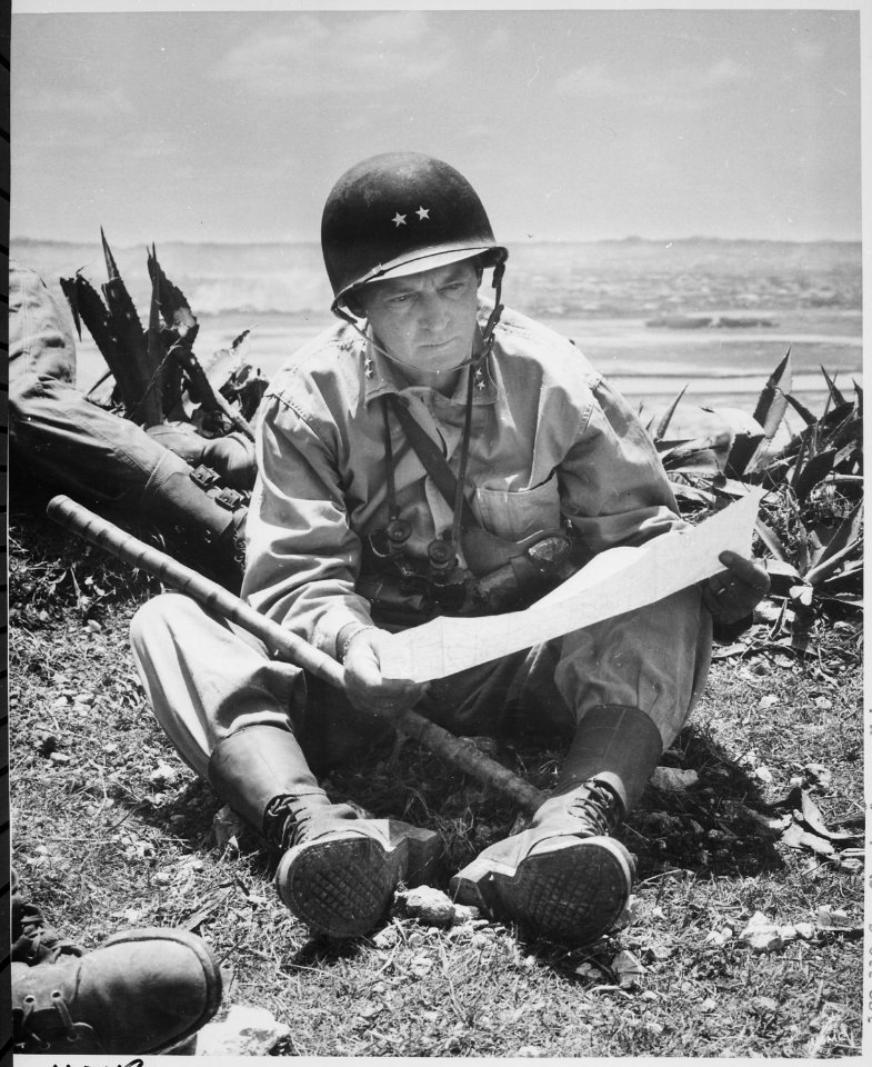 With the captured capital of Naha as a background, Marine Maj. Gen. Lemuel Shepherd, commanding general of the 6th Mari - NARA - 532373