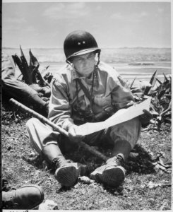 With the captured capital of Naha as a background, Marine Maj. Gen. Lemuel Shepherd, commanding general of the 6th Mari - NARA - 532373