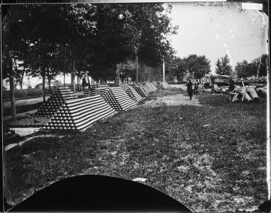(View of rows of stacked cannon balls.) - NARA - 528102