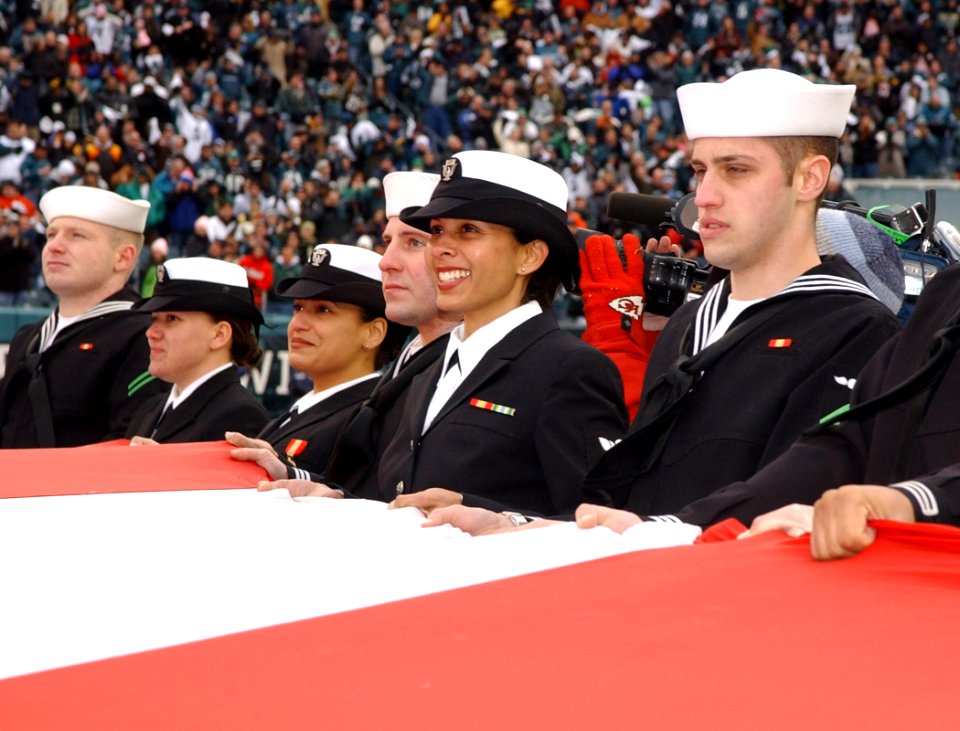 050116-N-4729H-146 Sailors from Naval Air Station Joint Reserve Base Willow Grove, Pa. hold a giant American flag in a National Football League pregame ceremony in Philadelphia between the Philadelphia Eagles and Minnes